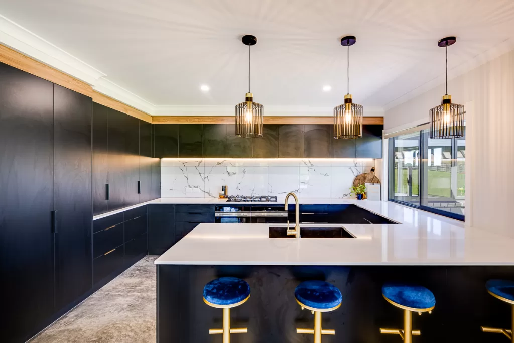 Ohangai Road project showcasing stunning black kitchen with engineered stone bench top, hanging pendant lights and trendy bar stools. 

Proudly designed and built by BuildtechNZ - Bespoke New Home Builders.